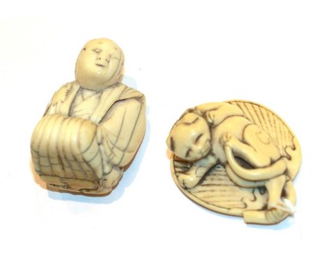 Japanese ivory netsuke, cat on a leaf, 4.5cm wide; and another as a kneeling man, 4.3cm high (2).  Total weight 45g, Cat and 