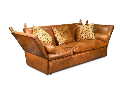 A large three-seater Knole sofa, modern, with drop ends and three squab cushions upholstered in tan leather98 x 220 x 106cmPr