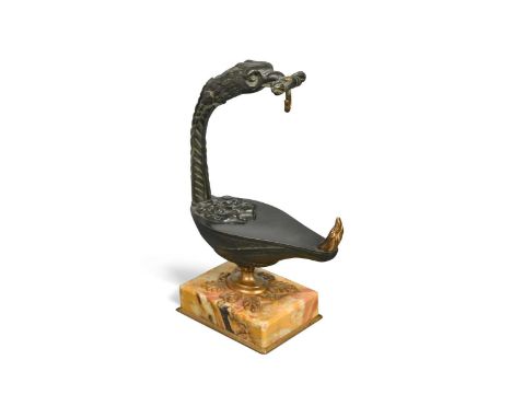 A grand tour bronze pocket watch holder, 19th century, in the form of a Roman oil lamp with eagle head, mounted to a marble b