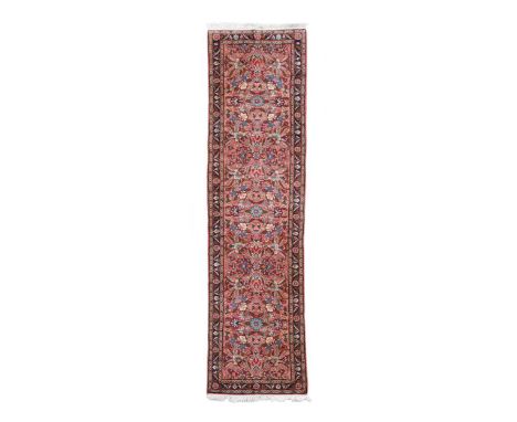 A Sarouk runner, the overall floral design on a terracotta ground324 x 84cmCondition report: Excellent, even pile with no obv