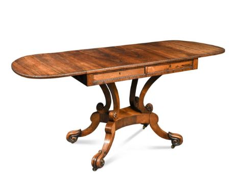 A Victorian rosewood sofa table, the frieze with diagonally opposing real drawers on C-scroll and lapith quadripartite base74