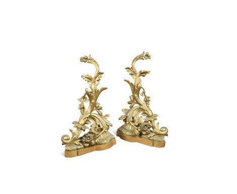 A pair of French ormolu chenets, 18th/19th century, in the Rococo style decorated with scolling foliage50 x 33 x 15cmConditio