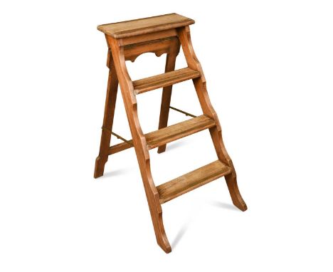 A set of mahogany and brass folding library steps, circa 1900, the four treads with brass strips and shaped side rails81 x 40