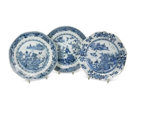Twenty Chinese blue and white export plates, 18th century, decorated with river landscapes, figures in a fenced garden the la