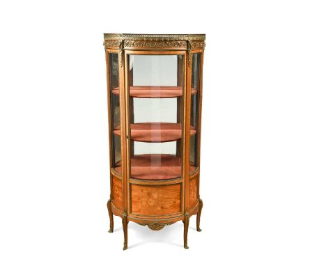 A gilt mounted marquetry vitrine, circa 1900, with pressed brass gallery to the top, enclosed by shaped glazed door with inla