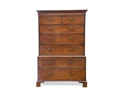 A George III mahogany chest-on-chest, the dental moulded cornice above an arrangement of two short over five long drawers rai