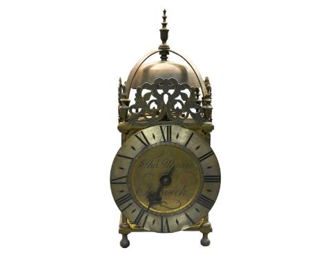 A brass lantern clock signed 'Thos Moore Ipswich', circa 1900, the bell top case above typical 30hour movement with anchor es