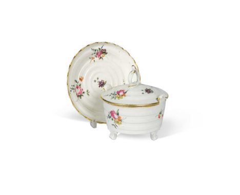A Chelsea-Derby two-handled butter tub, cover and stand, circa 1770, the moulded body painted with scattered roses, gilt dent