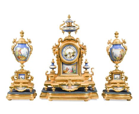 A French gilt metal and porcelain clock garniture, 19th century, in Sevres style with urn finial above painted 8cm dial and t