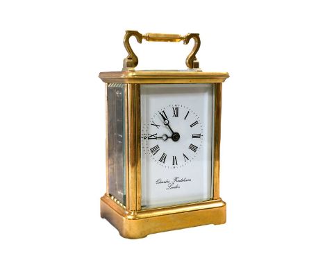 A modern brass carriage clock by Charles Frodsham, London, platform lever escapement above signed white dial, with bell strik