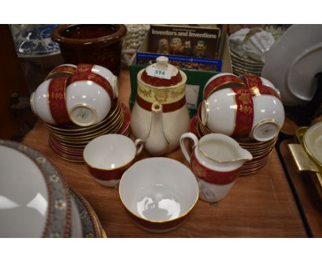 A part tea service by Tuscan China having gilt and burgundy design