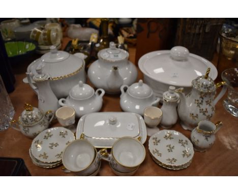 A selection of table ware ceramics including tureen tea pot and part coffee service