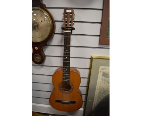 A vintage Encore by John Hornby Skewes student guitar, model ENC36N, soft case and couple of music books including Complete G