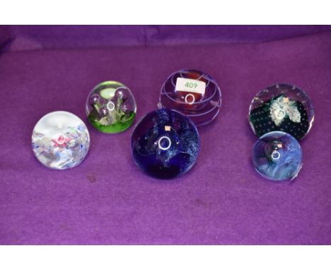 A fine selection of art glass paper weights by Caithness including hand signed