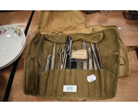 A selection of surgeons and doctors medical field instruments including scalpel razor etc,
Appears to be military, but no bro