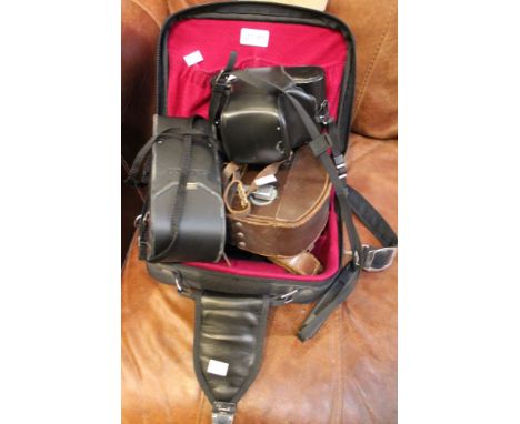A Minolta XGM SLR 35mm camera with extra lenses, including wide angle and zoom, together with a Weston Master ll exposure met