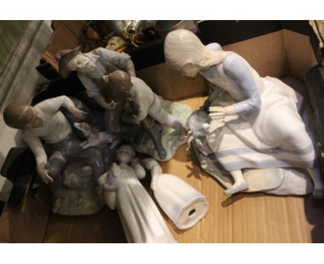 A Lladro porcelain figure of Fishing with Grandfather, together with other Nao figures of children, some with animals, a/f Co