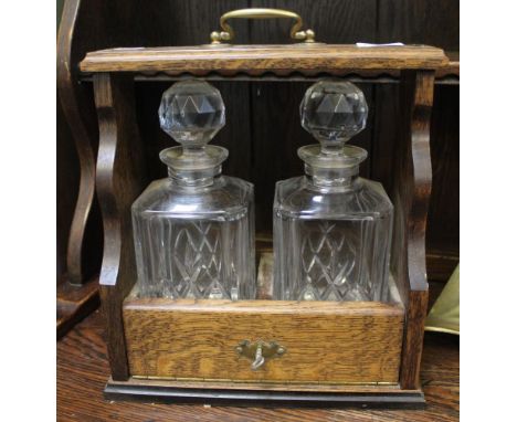 A Tantalus containing two decanters