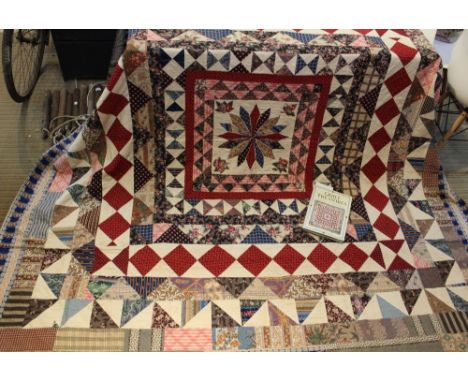 A 19th century patchwork frame quilt, made by the Thornton sisters of Mirfield, Yorkshire, probably made between 1840-1860, 2