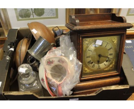 A box containing a mantle clock, decanters, Kurri knife etc