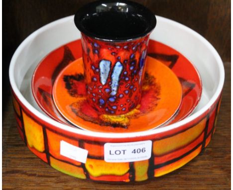 A Poole pottery dish, together with two smaller plates &amp; a small pot