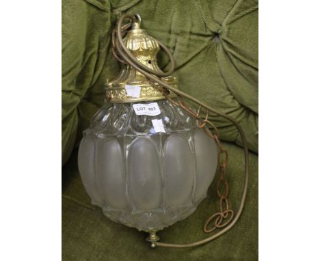 A pressed glass and brass globular hanging ceiling light