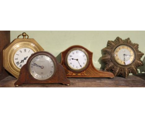 A gilt brass cased Swiss wall clock with a star burst wall clock and two mantle clocks (4)