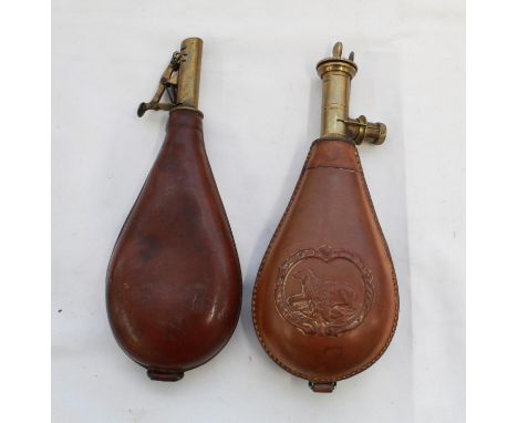 Brass and leather shot flask. Unusual brass and leather shot flask with separate shot measure. Depicting a lying dog 