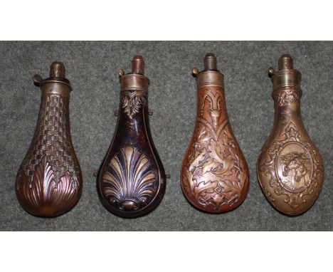 Copper and brass powder flask by Hawksley depicting oakleaf and stag's head design.Copper and brass powder flask by Dixon wit