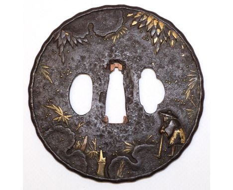 Japanese 17th century tsuba, possibly by Mumia to fit katana, with farmer and landscape design highlighted in gilt metal. (di