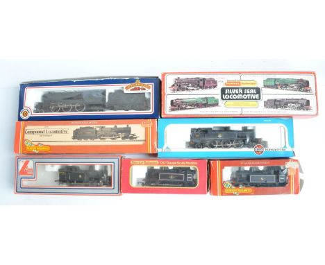 Seven boxed OO gauge electric steam train models (various manufacturers), all BR black liveried to include Hornby R859 4-6-0 