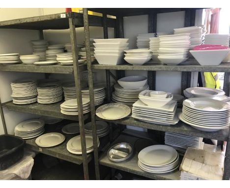 Stock of white commercial catering plates, saucers, and bowls.