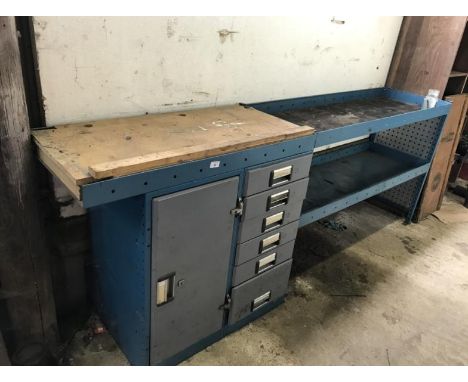 A combination tool chest and work box.