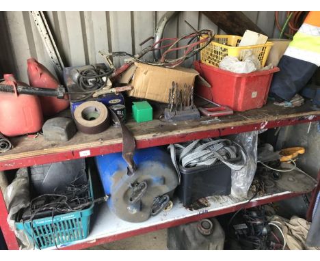 A steel work bench, and contents being chains, drill bits, ring, etc.
