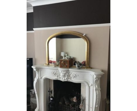 A Victorian style gilt framed overmantel mirror, ornaments and mantel clock.