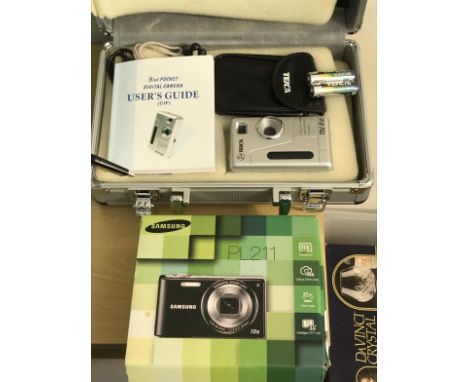 Two digital cameras, to include a Samsung PL211 and a Teica Tech V10 camera in case.