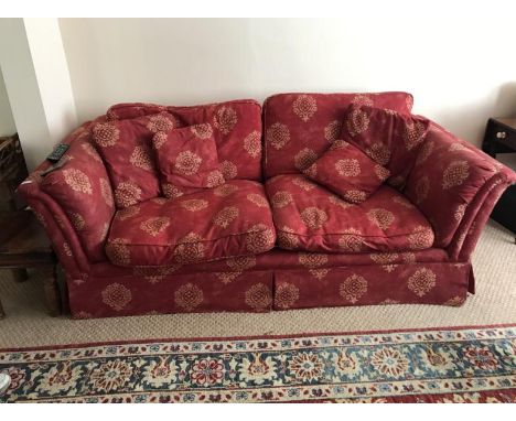A four piece lounge suite, comprising two sofas, armchair and pouffe.