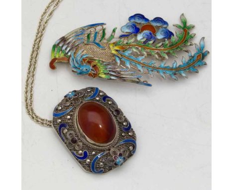 Chinese silver and enamel pendant set with a red cabochon, on trace chain; also a silver and enamel brooch of fenghuang.