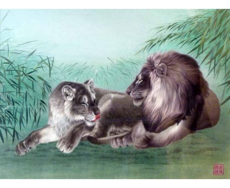 Chinese silk embroidered picture of a lion and lioness at ease amongst bamboo, archaic style seal mark, 55 x 77cm, framed.