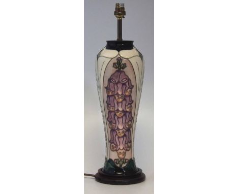 Moorcroft lamp base, decorated with fox gloves, mounted on wood base, the ceramic part measures 37cm, overall height 48cm    