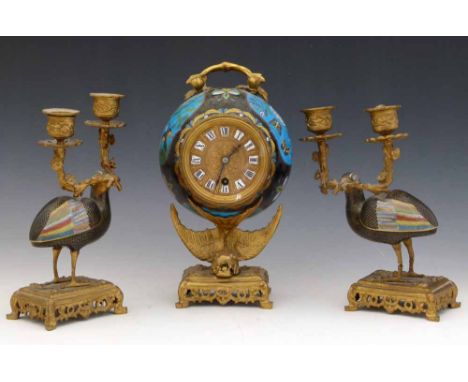 French clock garniture, circa 1890, of gilt brass and japanese cloisonne, the globular clock on a dragon support, flanked by 