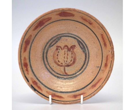 St Ives studio pottery dish attributed to Bernard Leach, painted with a flower head motif, impressed seal mark to foot, 16.5c
