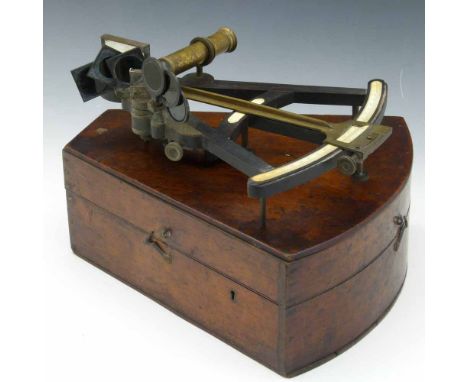 Brass, ebony and ivory octant, 19th century, with sighting telescope, red, orange and green shades, brass index arm, ivory ve