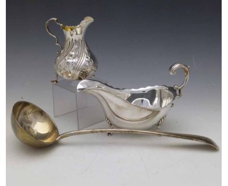 Georgian style silver sauce boat, Lee & Wigfull, Sheffield 1927, overall length 19cm; Victorian silver embossed baluster milk