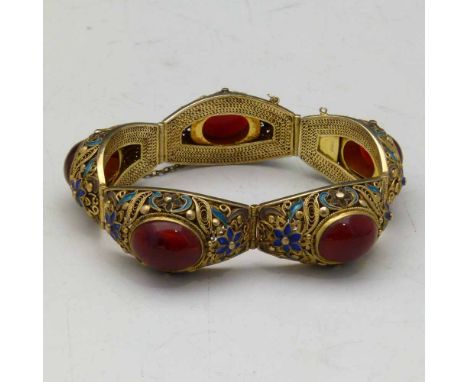 Chinese silver gilt and enamel bracelet set with red cabochon hard stones, marked "silver".