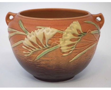Roseville U.S.A. Art Nouveau twin handled jardinière, moulded with flora on an orange ground, moulded marks to base, 23cm wid