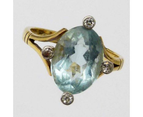 9ct gold ring set an oval aquamarine and four small diamonds, ring size N.