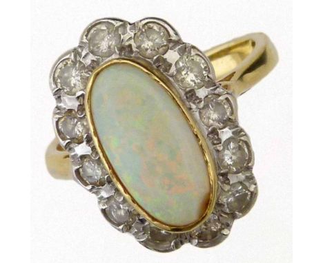 Oval opal and diamond cluster ring, set in 18ct (750) gold, London 2000, ring size M, gross weight 5.8g.