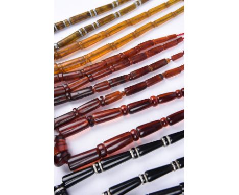 λSeven Mizo necklaces India / Burma amber, glass, resin and aluminium spacers, the longest 47cm. (7) Provenance Romy Rey Coll