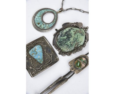 λA Navajo silver coloured metal and turquoise set belt buckle Southwest North America signed Michael Ronehorse ?, 7cm wide, a